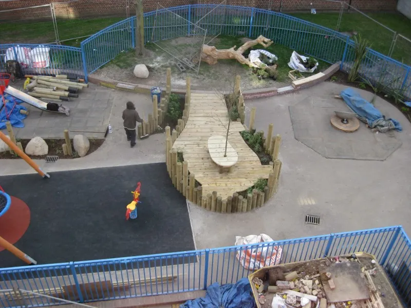 Commercial playground with custom timber boardwalk and natural play features