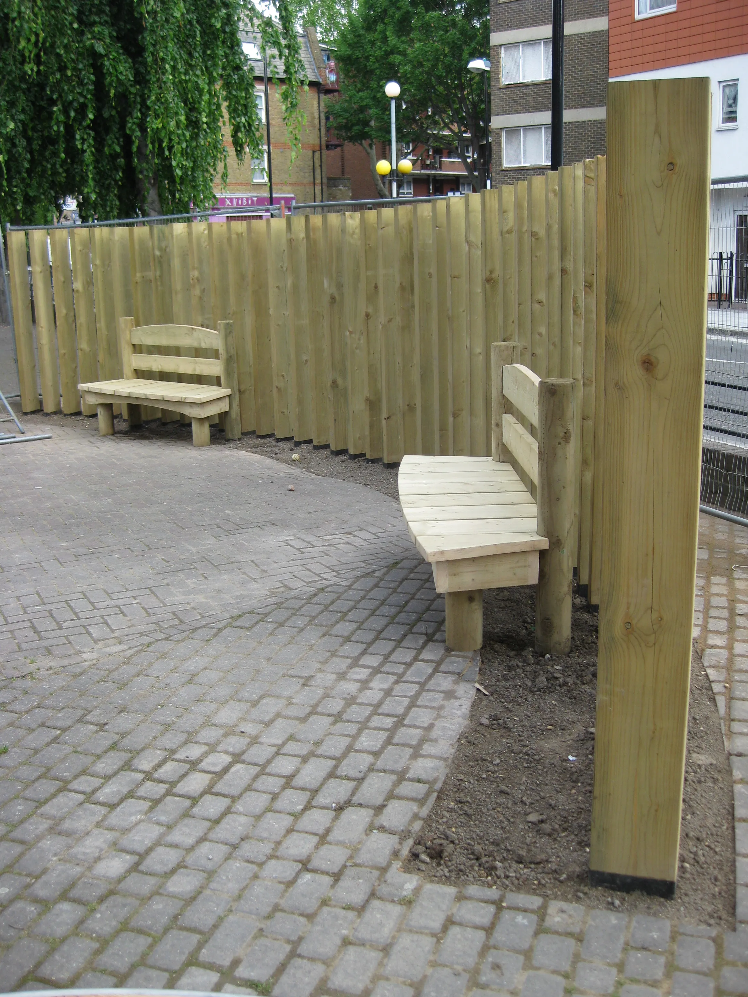 Timber fencing with a built-in wooden bench
