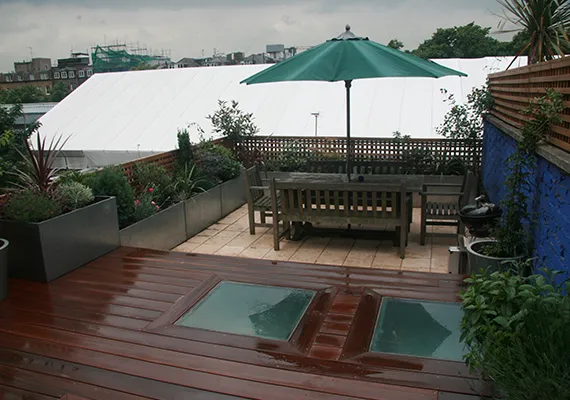 Rooftop terrace garden with hardwood decking and dining area